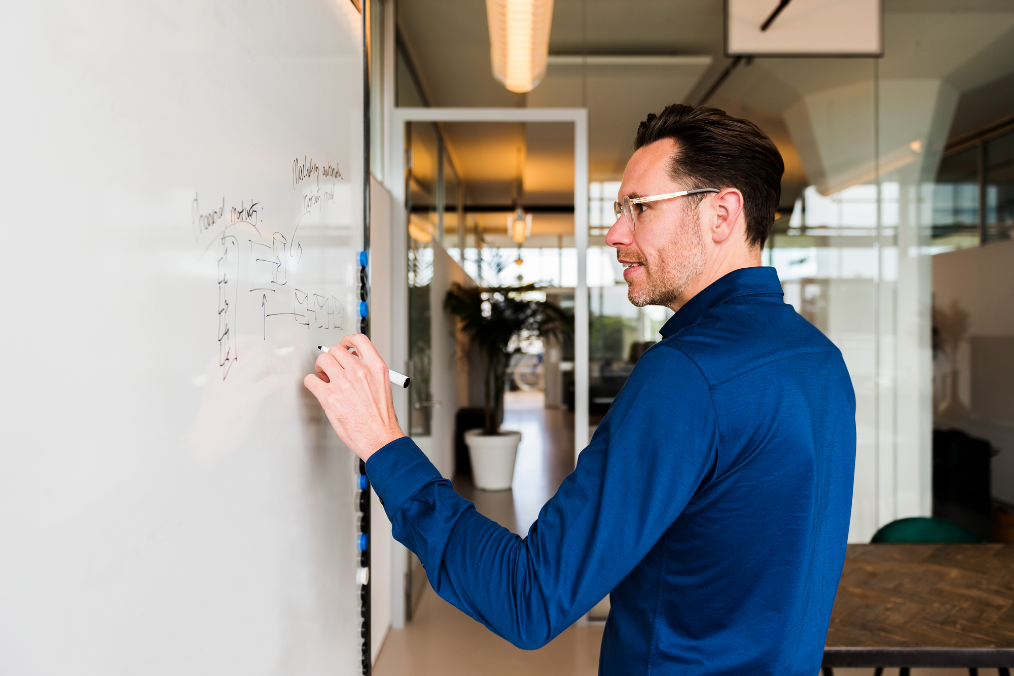 Brainstorming employee on white board
